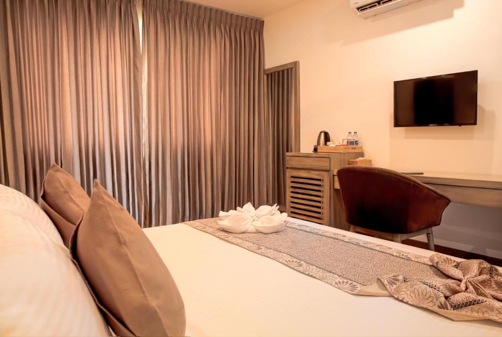 Postel nebo postele na pokoji v ubytování Ravo Hotel