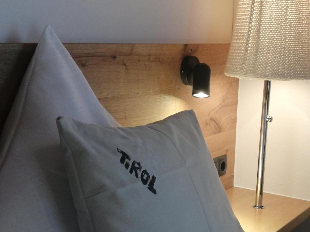 Postel nebo postele na pokoji v ubytování Huber - Das Tiroler B&B