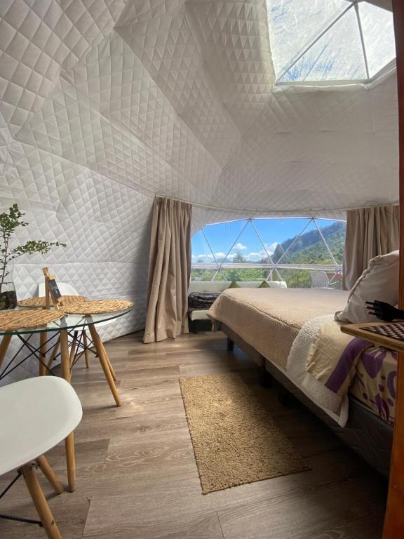 Postel nebo postele na pokoji v ubytování Milenaria Glamping