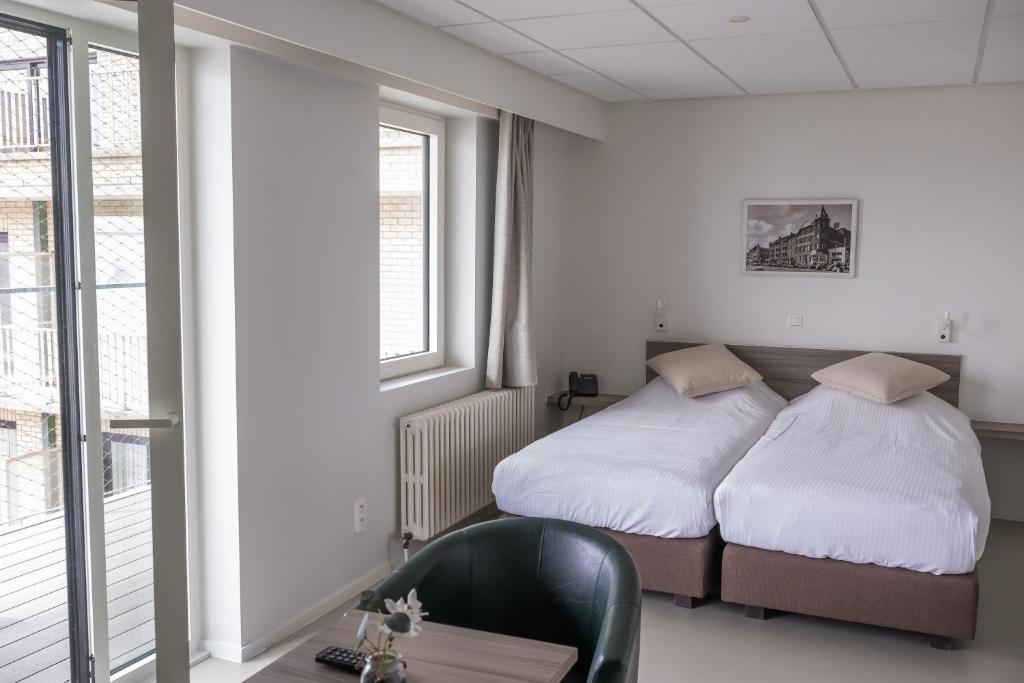 Postel nebo postele na pokoji v ubytování Rewindhotel
