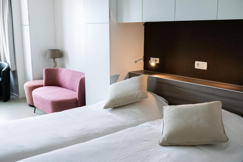 Postel nebo postele na pokoji v ubytování Rewindhotel