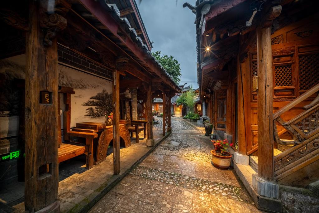 a street in an old town at night at Walk Together Hotel in Lijiang