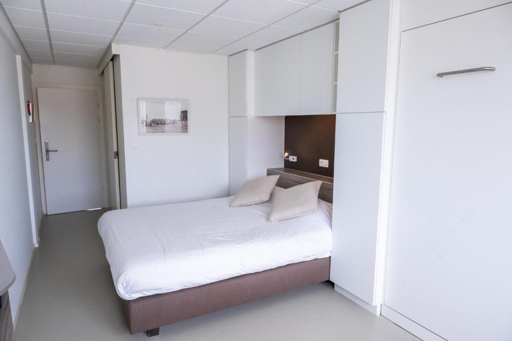 Postel nebo postele na pokoji v ubytování Rewindhotel