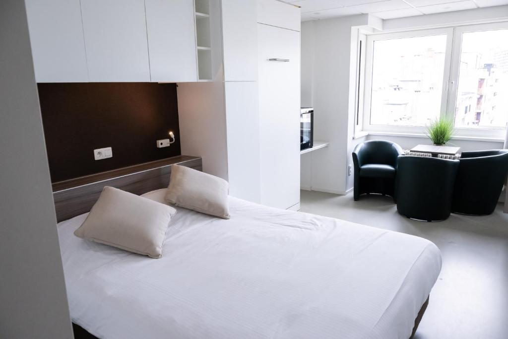 Postel nebo postele na pokoji v ubytování Rewindhotel