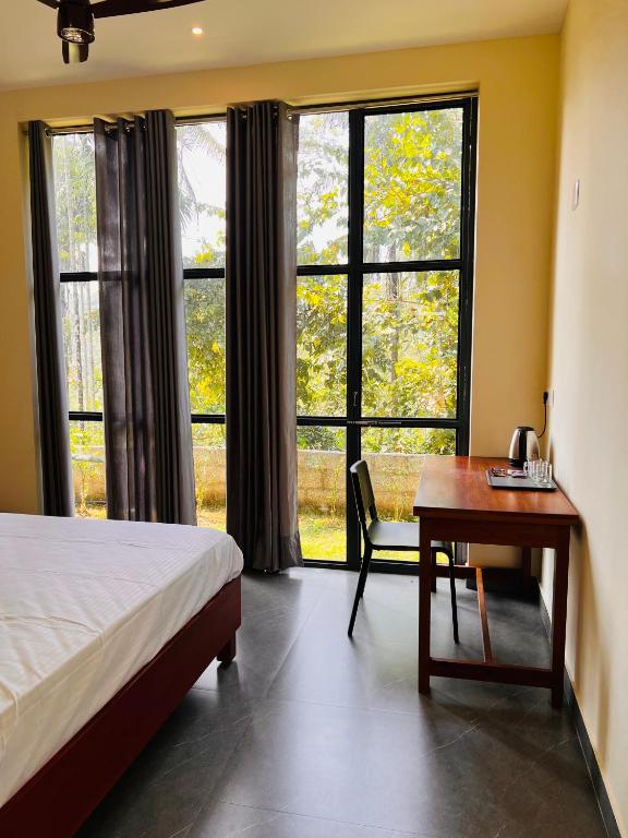 Postel nebo postele na pokoji v ubytování Hill View Heights Wayanad