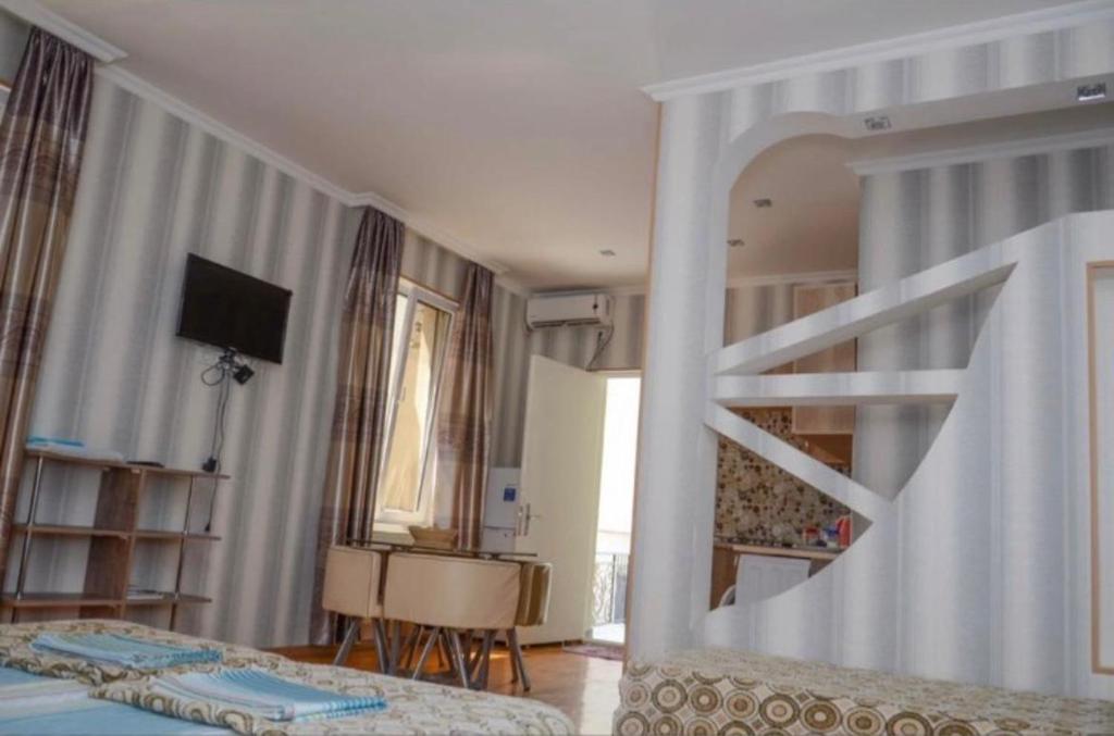 Postel nebo postele na pokoji v ubytování Kutaisi Best Guesthouse
