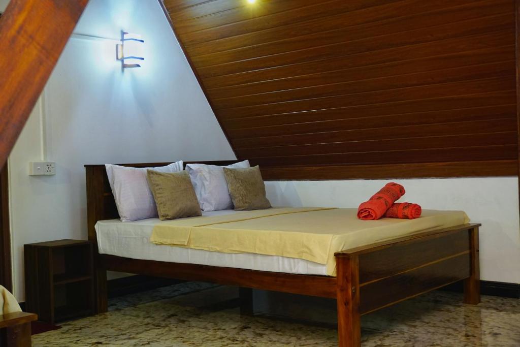 Postel nebo postele na pokoji v ubytování Sigiri Sky Home & TreeHouse