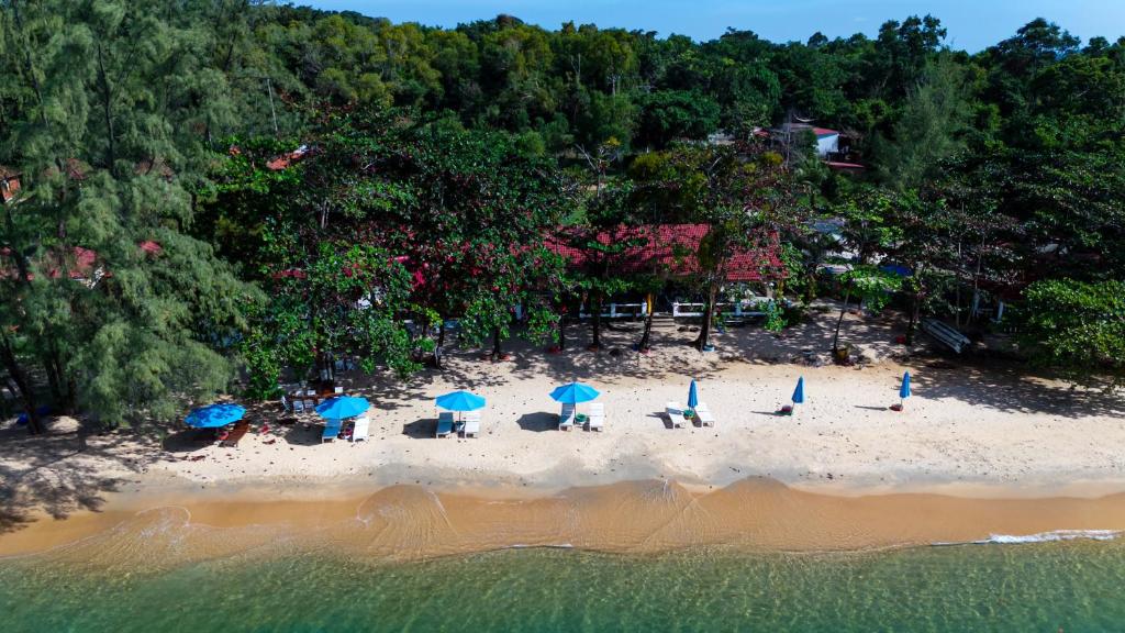 an aerial view of a beach with chairs and umbrellas at Vung Bau Resort in Phú Quốc