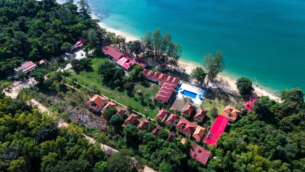 an aerial view of a house on a hill next to the ocean at Vung Bau Resort in Phú Quốc