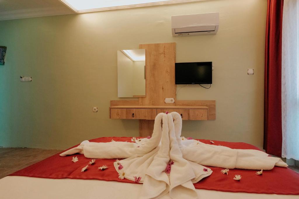 Postel nebo postele na pokoji v ubytování Tunacan Hotel