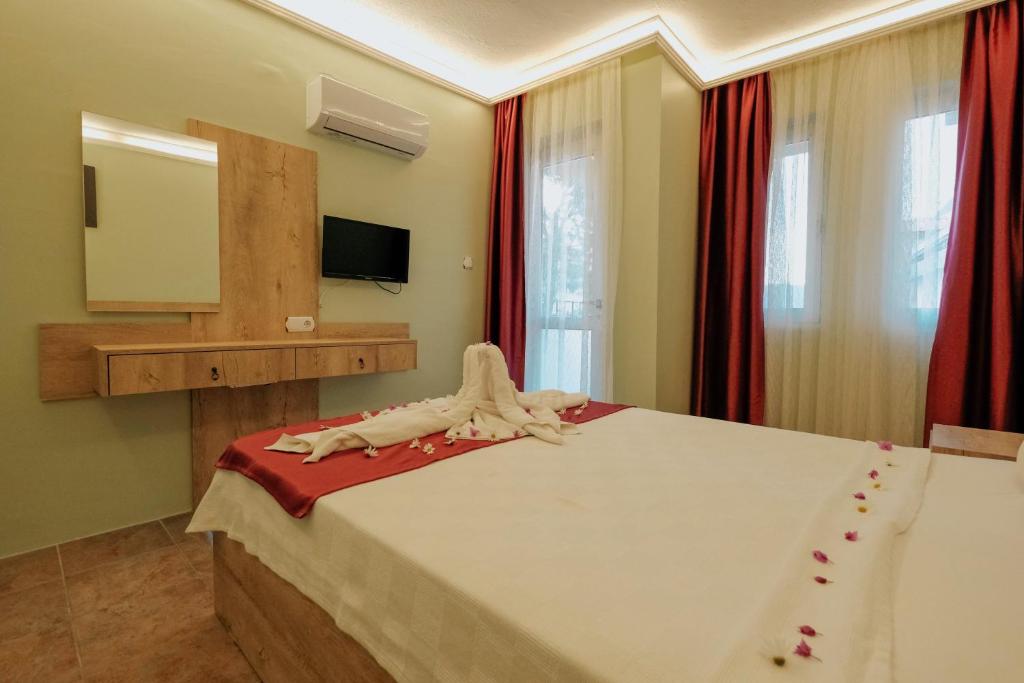Postel nebo postele na pokoji v ubytování Tunacan Hotel