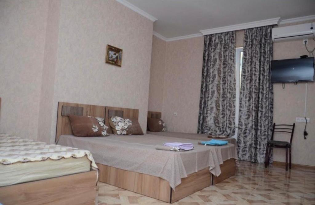 Postel nebo postele na pokoji v ubytování Kutaisi Best Guesthouse