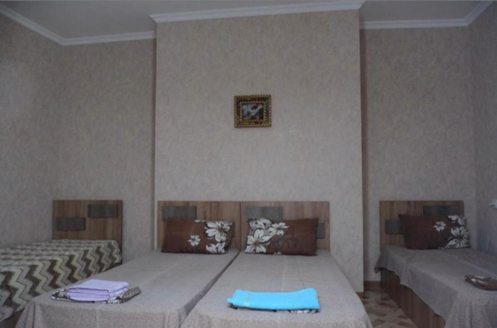 Postel nebo postele na pokoji v ubytování Kutaisi Best Guesthouse