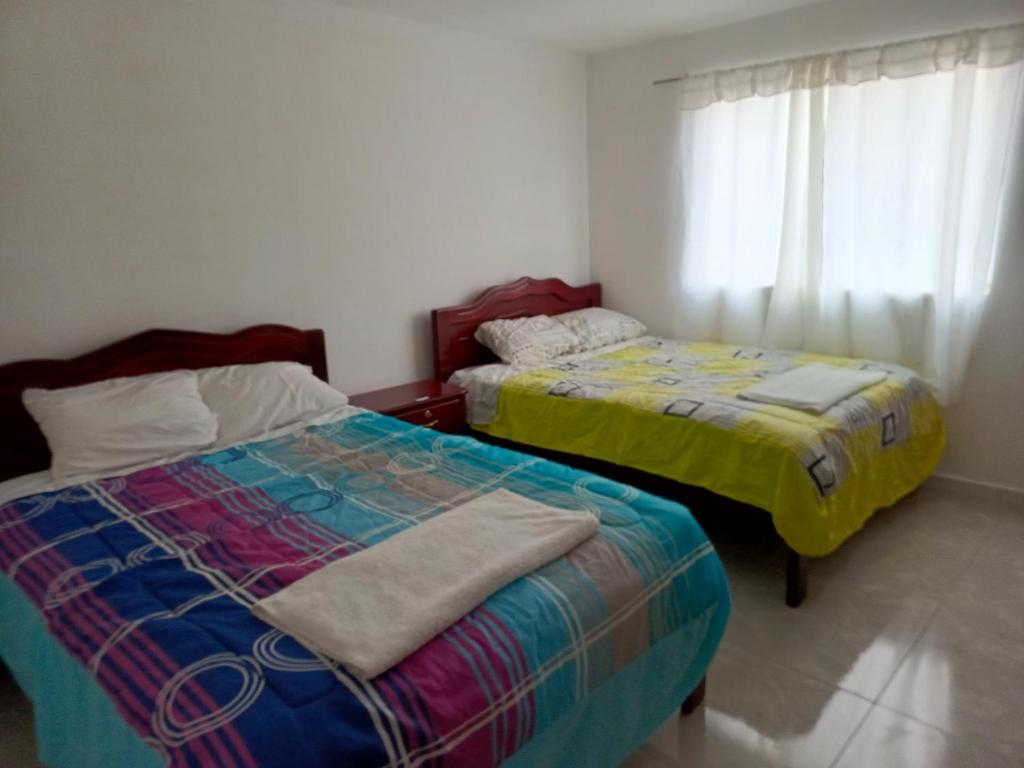 Postel nebo postele na pokoji v ubytování Hotel CasaBlanca"Tablon de miraflores"