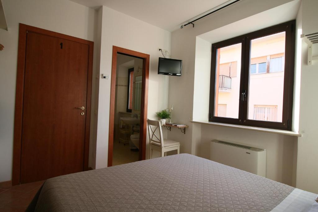 Postel nebo postele na pokoji v ubytování Conero Camere