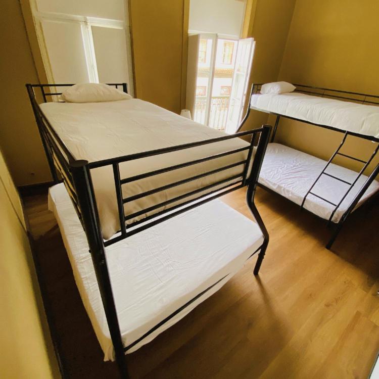 Postel nebo postele na pokoji v ubytování Casa Quixote