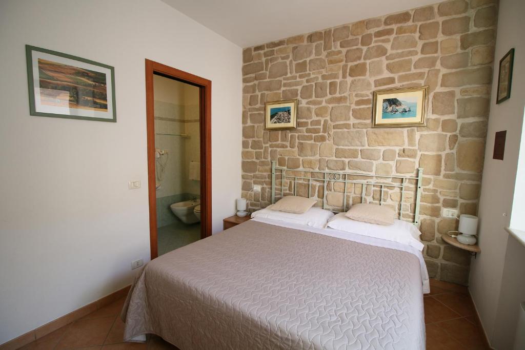 Postel nebo postele na pokoji v ubytování Conero Camere