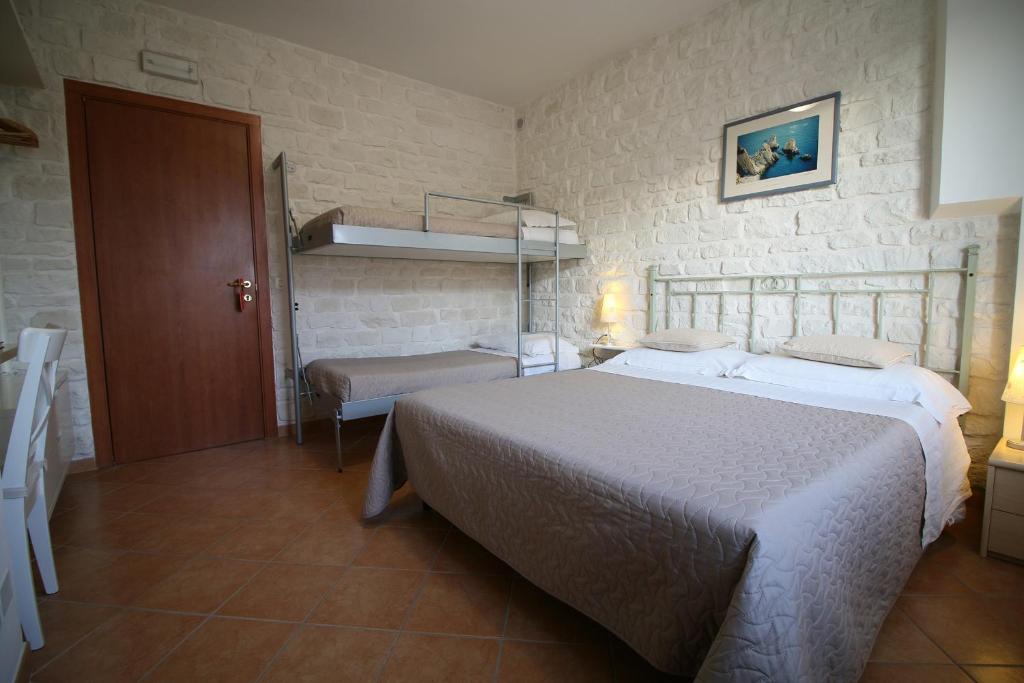 Postel nebo postele na pokoji v ubytování Conero Camere
