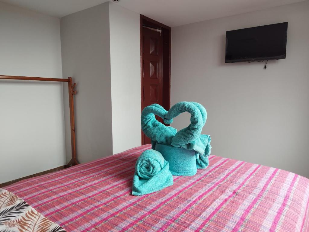 Postel nebo postele na pokoji v ubytování Hostal Terranova Quitumbe