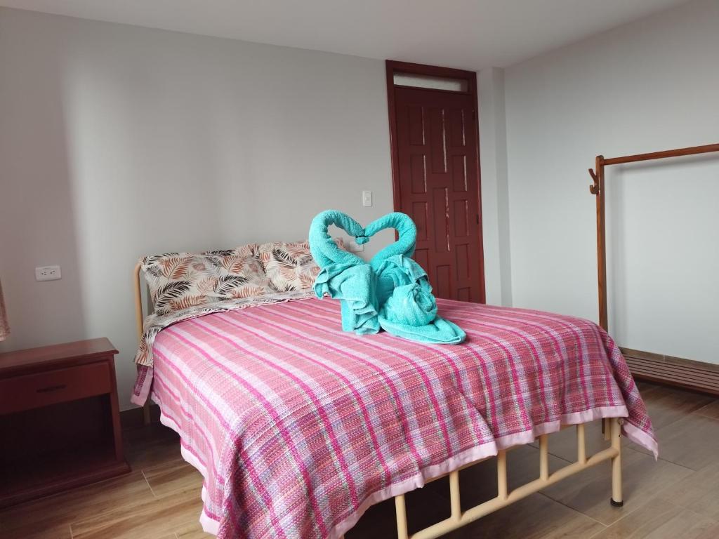 Postel nebo postele na pokoji v ubytování Hostal Terranova Quitumbe