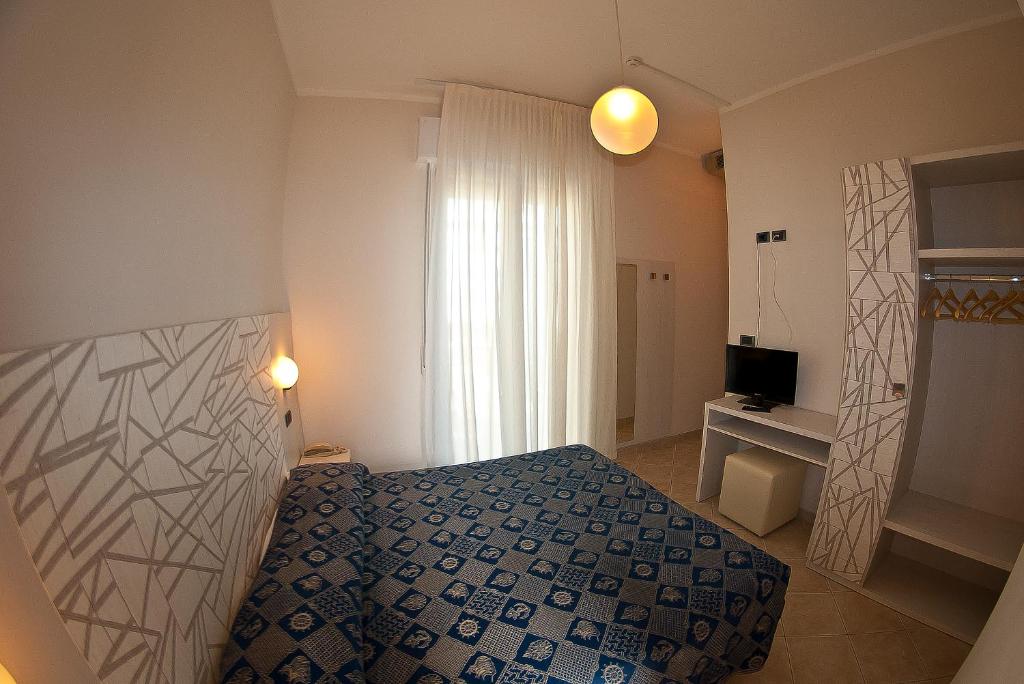 Postel nebo postele na pokoji v ubytování Hotel Alba D'Oro