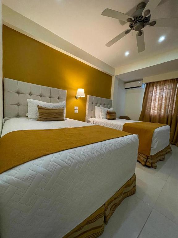Postel nebo postele na pokoji v ubytování Nilka Hotel Boutique