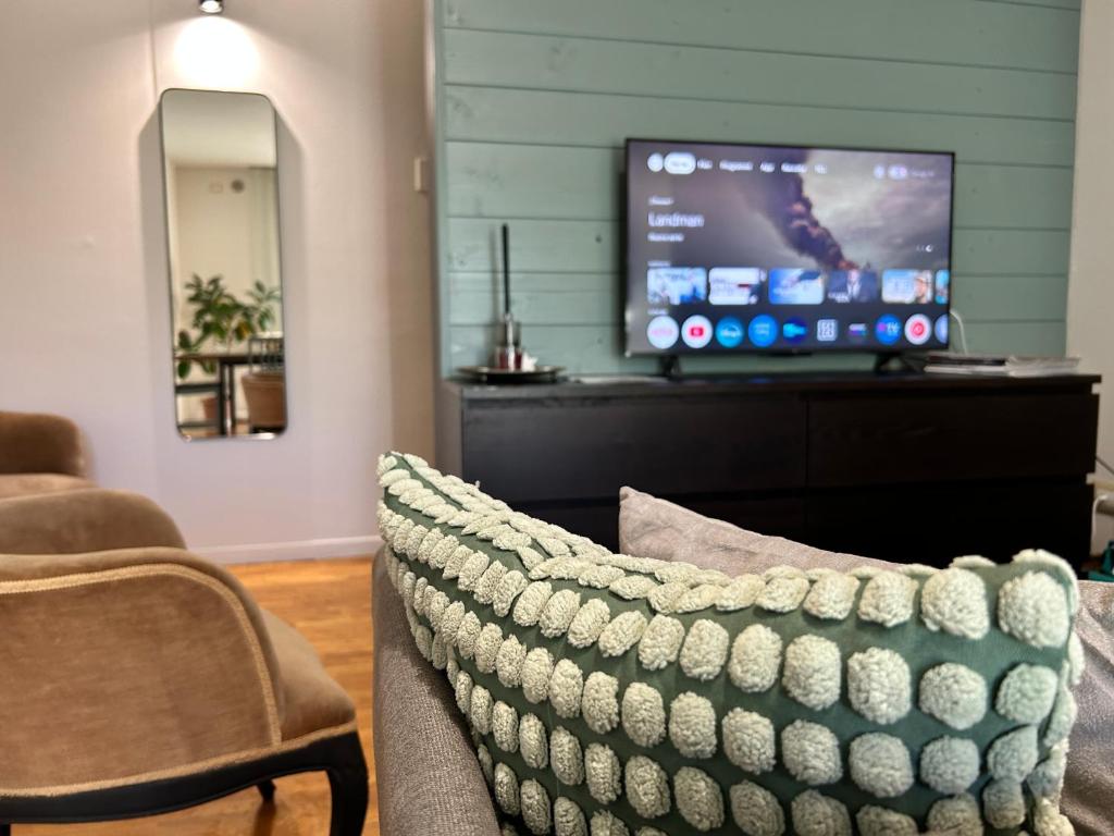 TV a/nebo společenská místnost v ubytování Bilocale moderno a Conselve