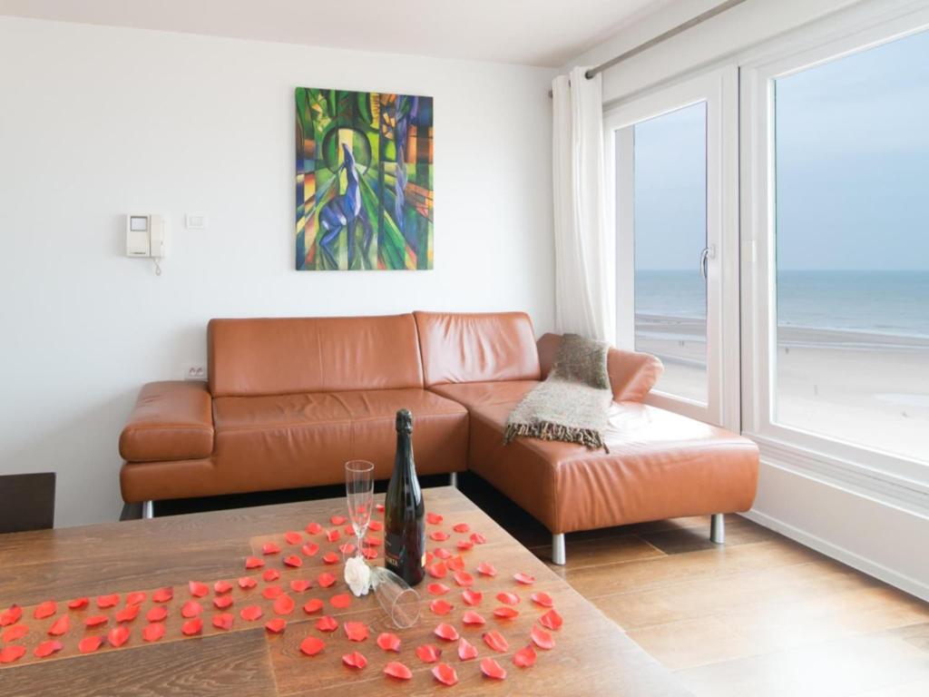 a living room with a couch and a table at Studio in Ostend near Beach and Promenade in Ostend