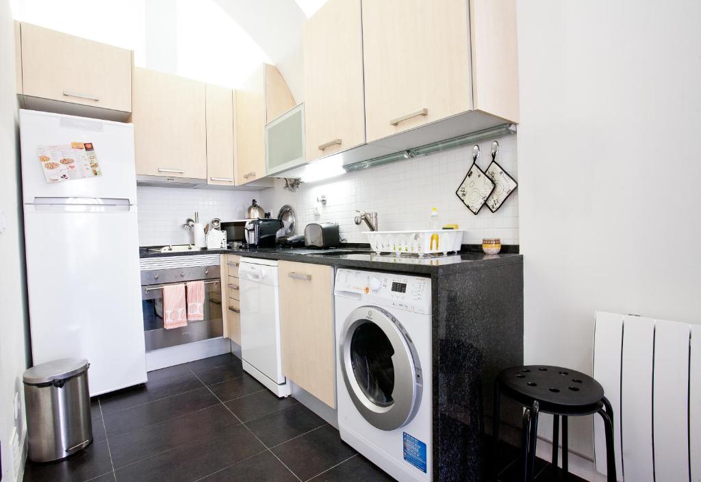 Kuchyň nebo kuchyňský kout v ubytování Downtown Apartments Bica