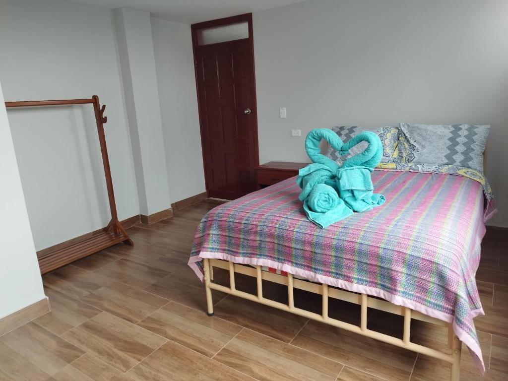 Postel nebo postele na pokoji v ubytování Hostal Terranova Quitumbe