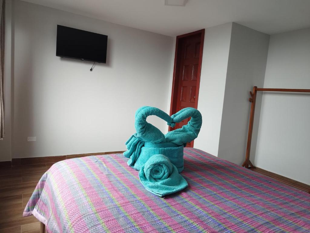 Postel nebo postele na pokoji v ubytování Hostal Terranova Quitumbe