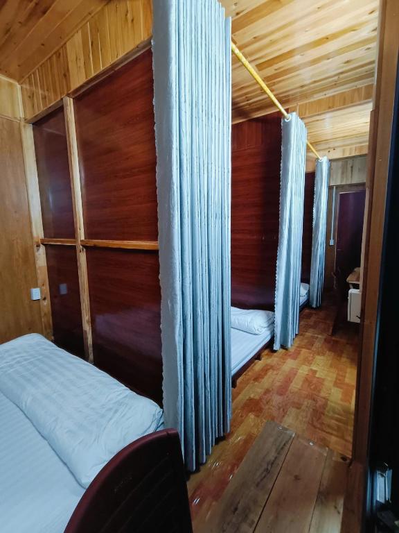 Postel nebo postele na pokoji v ubytování Moc's House