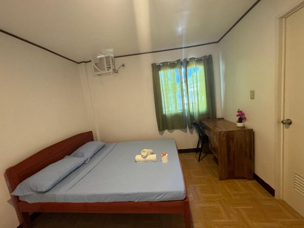 Postel nebo postele na pokoji v ubytování Dandal Bay View Inn