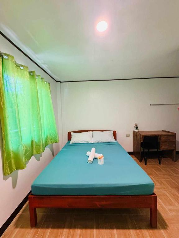 Postel nebo postele na pokoji v ubytování Dandal Bay View Inn