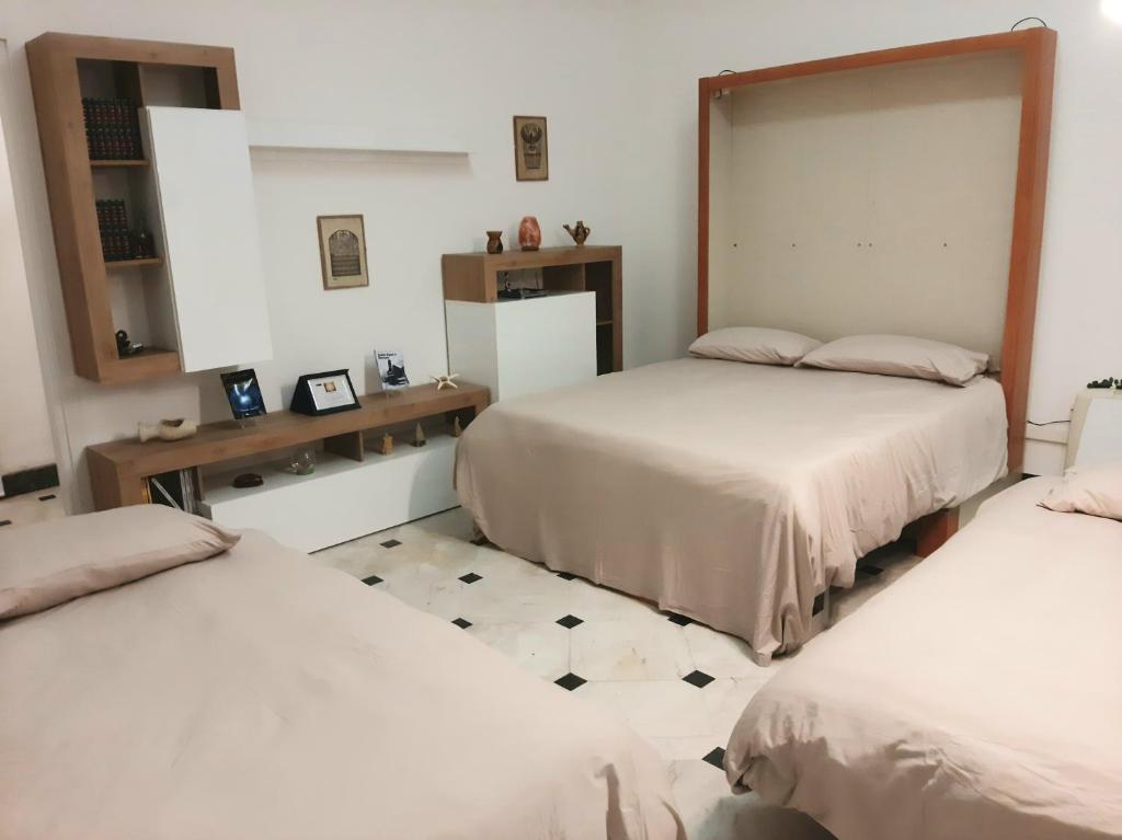 Postel nebo postele na pokoji v ubytování Laboratorio onirico