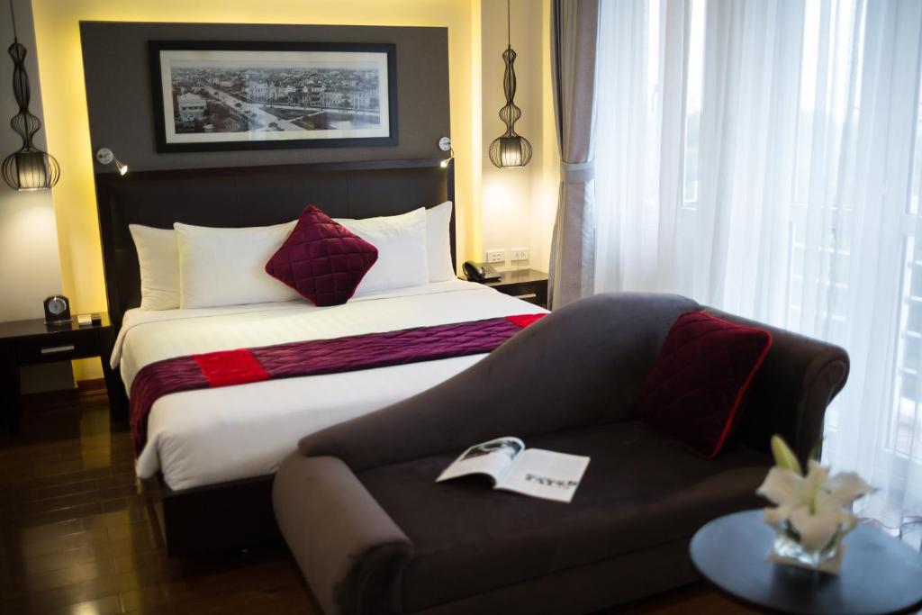 Postel nebo postele na pokoji v ubytování Hanoian Central Hotel & Spa
