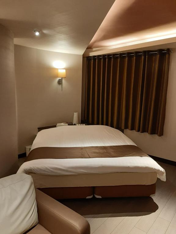 Postel nebo postele na pokoji v ubytování Hotel GOLF Nirasaki (Adult Only)