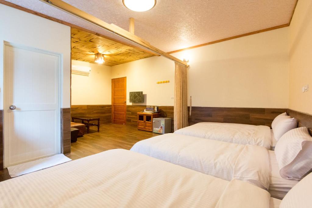 Postel nebo postele na pokoji v ubytování Donglifang B&B