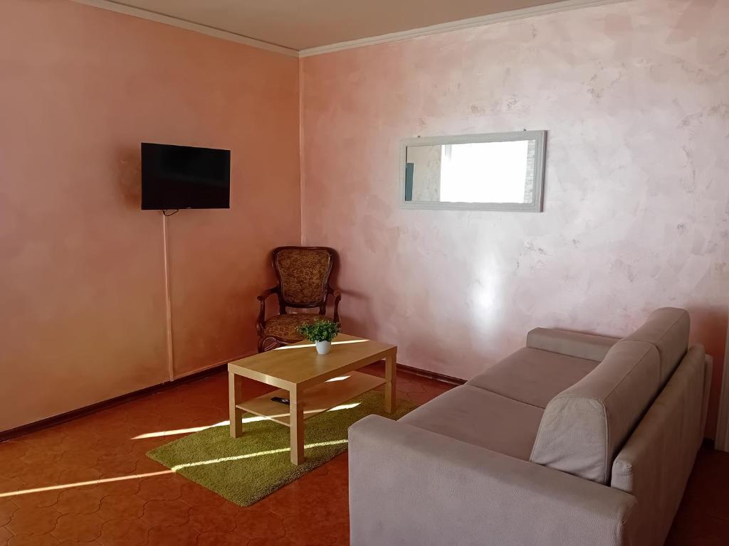Telewizja i/lub zestaw kina domowego w obiekcie Garda City Home Family Apartments