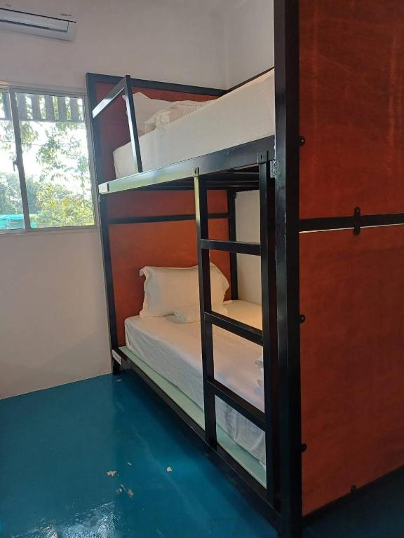 Postel nebo postele na pokoji v ubytování Green Gen Hotel, Mueang Phuket