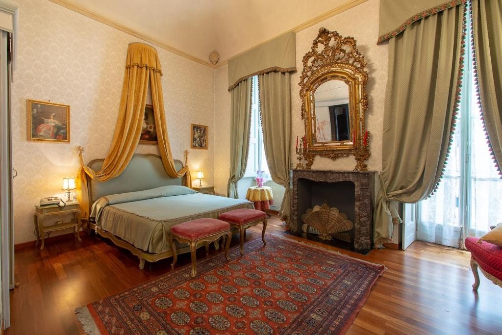Postel nebo postele na pokoji v ubytování Hotel Antica Dogana