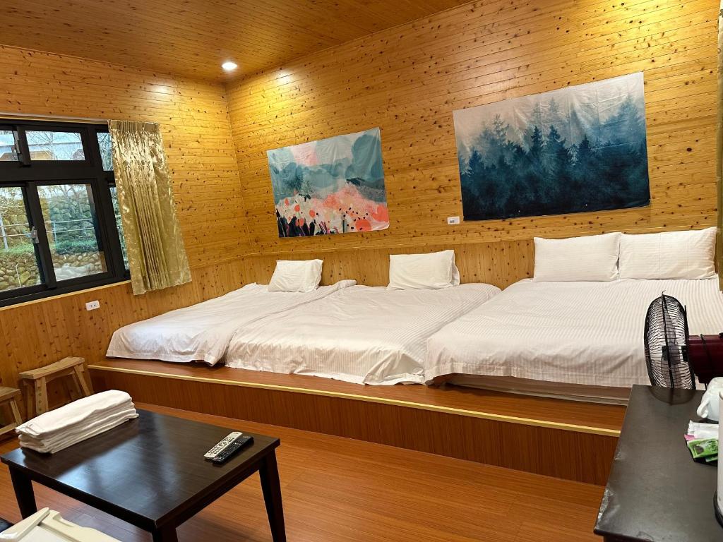 Postel nebo postele na pokoji v ubytování He Ya Leisure Land B&B
