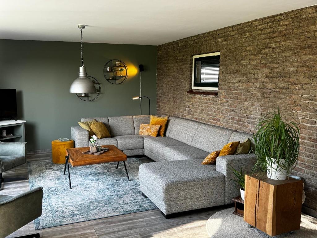 Posezení v ubytování Vakantiewoning Le Garaazje