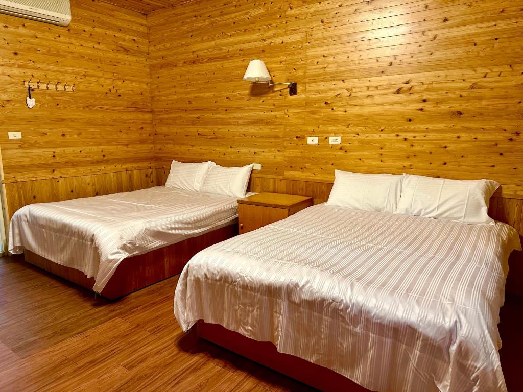 Postel nebo postele na pokoji v ubytování He Ya Leisure Land B&B