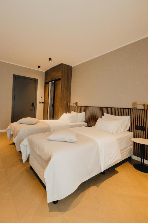 Postel nebo postele na pokoji v ubytování Hotel Flaneur