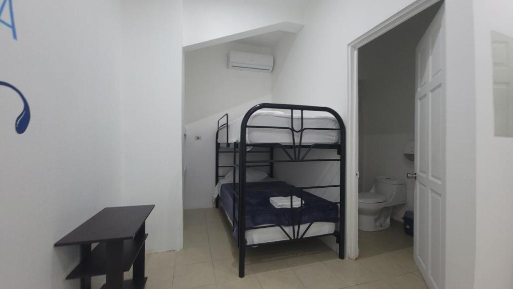 Postel nebo postele na pokoji v ubytování Surfo House Hotel & Hostel