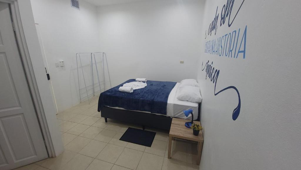 Postel nebo postele na pokoji v ubytování Surfo House Hotel & Hostel