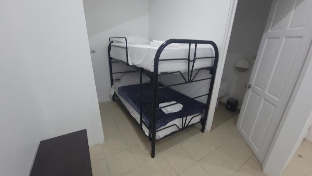 Postel nebo postele na pokoji v ubytování Surfo House Hotel & Hostel
