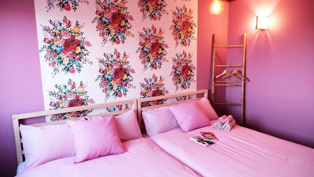 Guesthouse HOALOHA 4 SEASONSにあるベッド