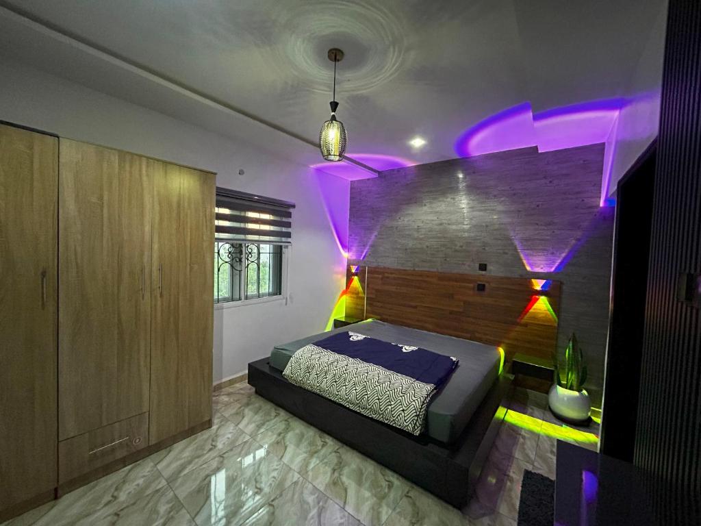 Postel nebo postele na pokoji v ubytování Abiodun Prime Apartment